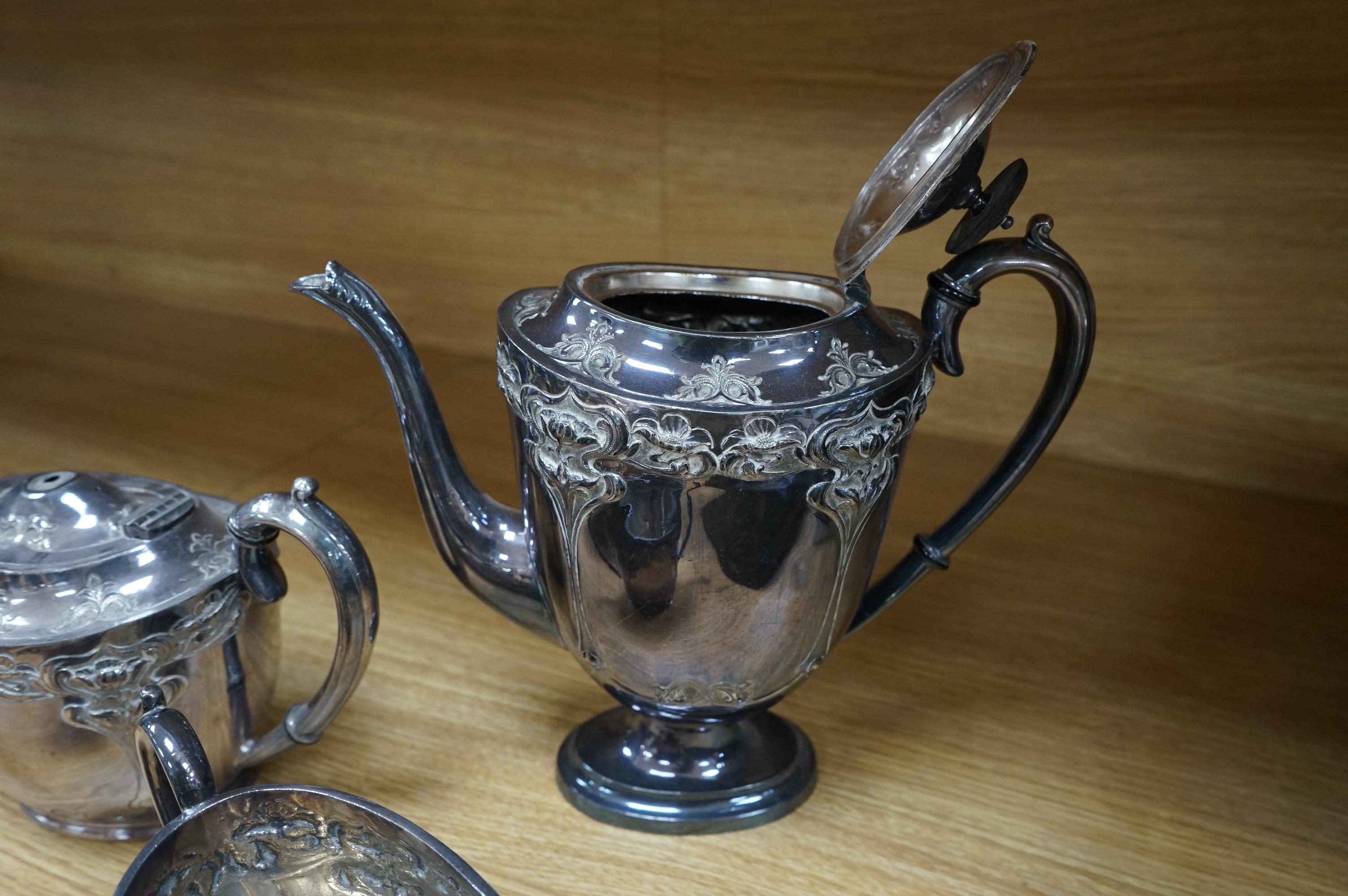 Four piece plated tea and coffee service, coffee pot 25cm high. Condition - teapot finial missing